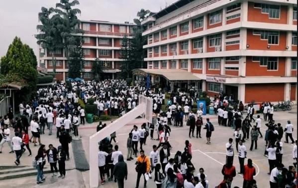 Campus area in Lalithpur, Nepal, with modern campus buildings and masses of students in the campus area.